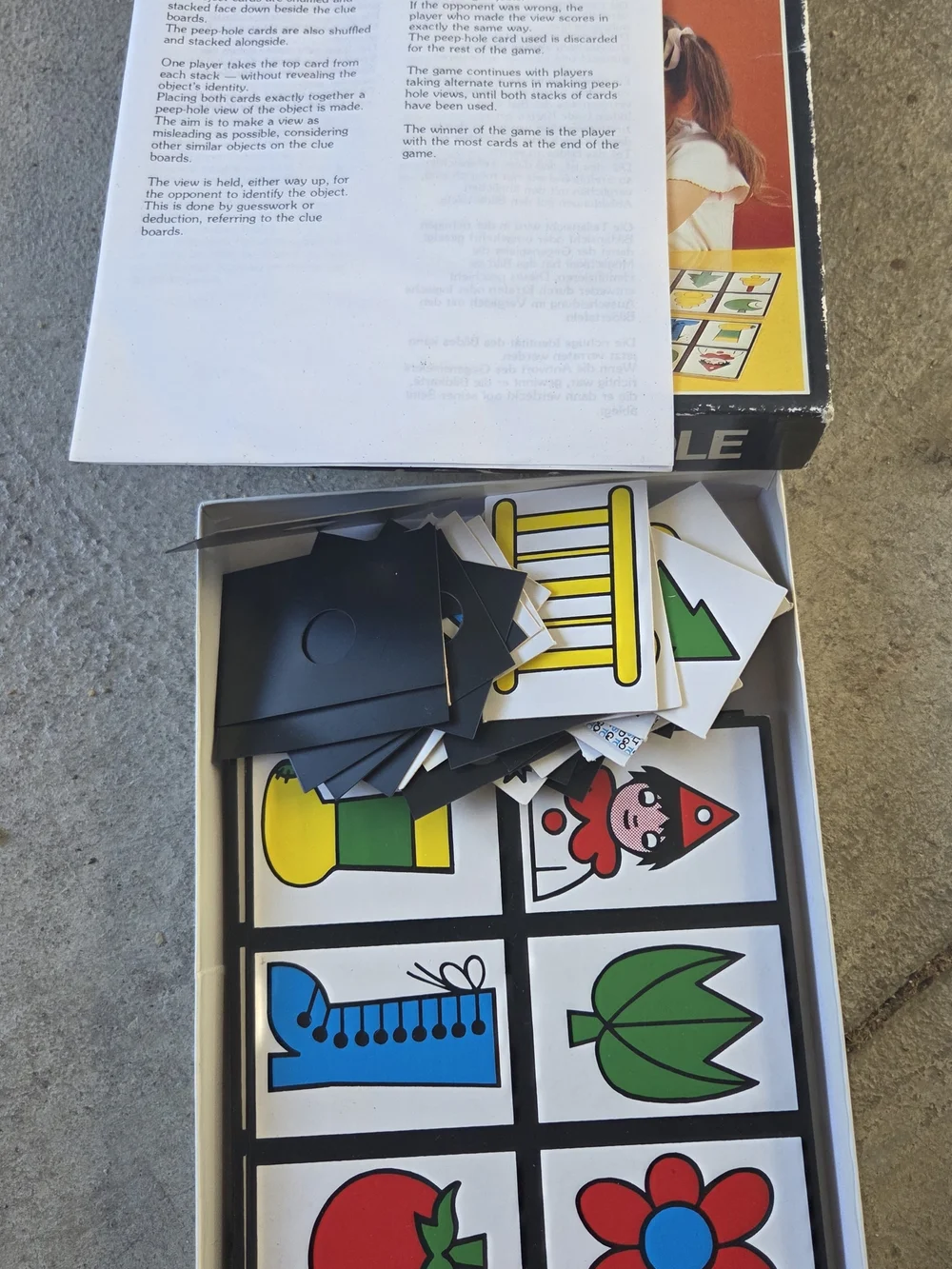 Peep-Hole Kids Board Game - Black with Multicolor Artwork